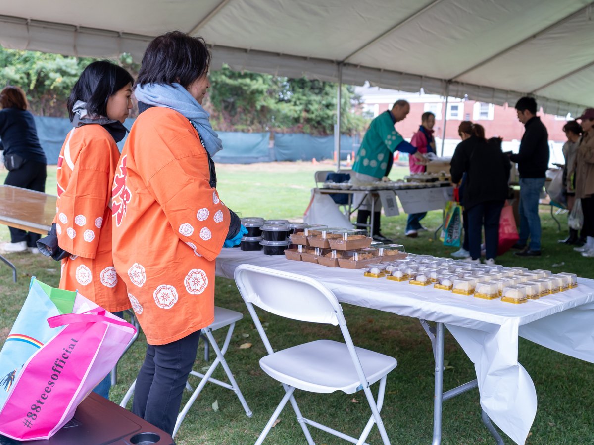 Last year's bazaar: volunteers selling in matching happi coats