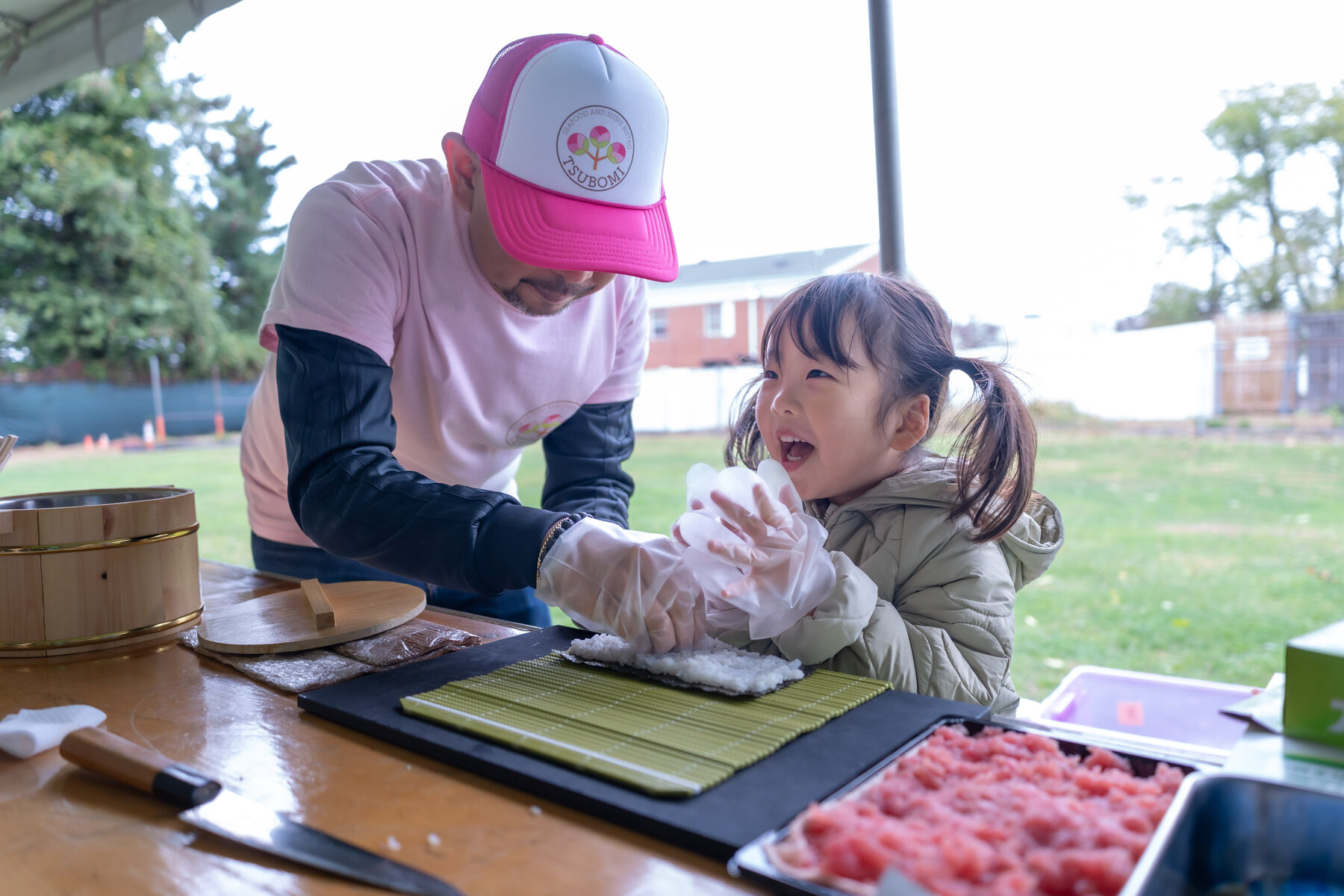A child making hand-rolled sushi at last year's bazaar